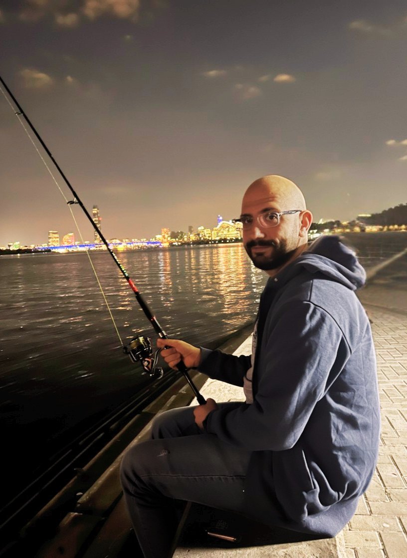 Mo at Dubai Creek with the city skyline behind